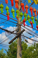 Danger! High Voltage with colorful paper lanterns.