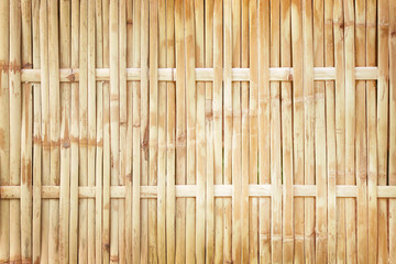 old grungy thai handcraft of bamboo weave pattern fence texture background