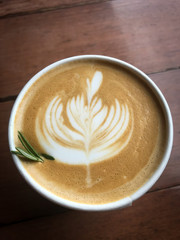 cup of coffee with cream on white background