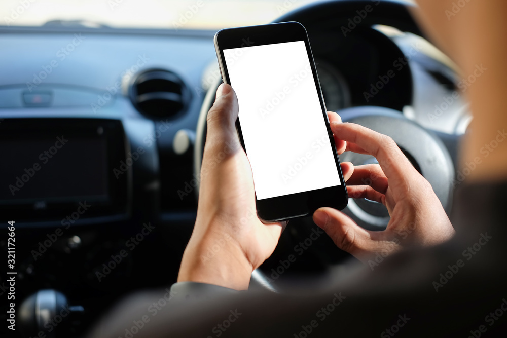 Poster cropped shot view the driver uses the phone while driving. modern smart phone with round edges. isol