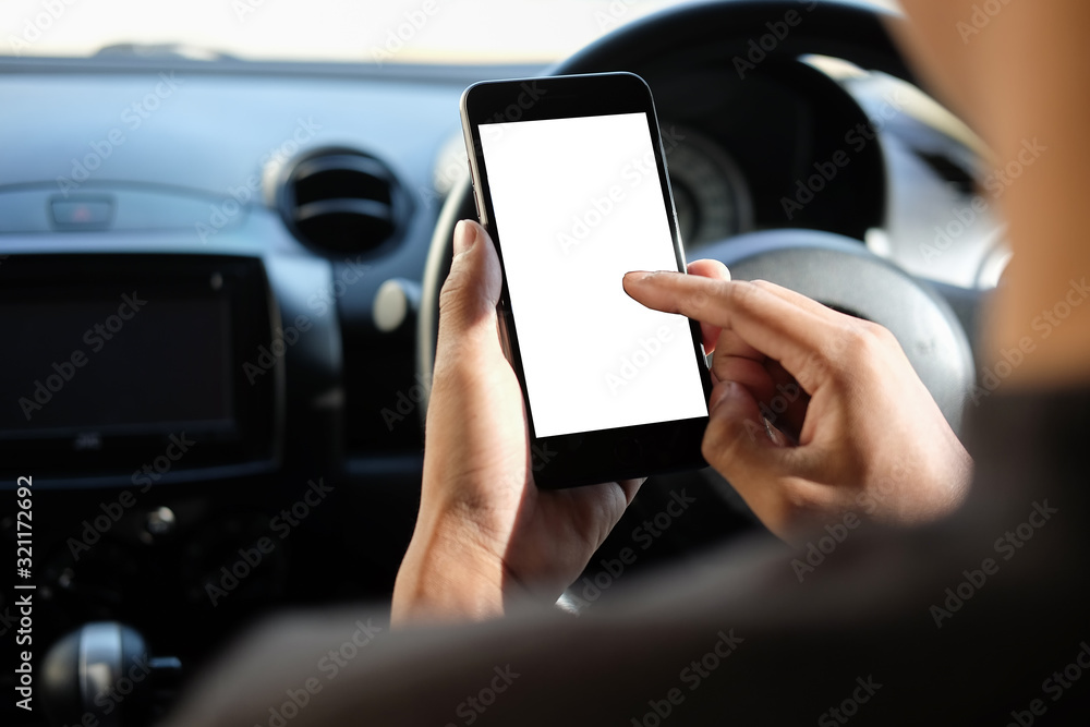 Poster cropped shot view the driver uses the phone while driving. modern smart phone with round edges. isol