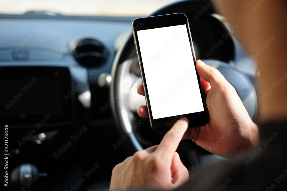 Poster cropped shot view the driver uses the phone while driving. modern smart phone with round edges. isol