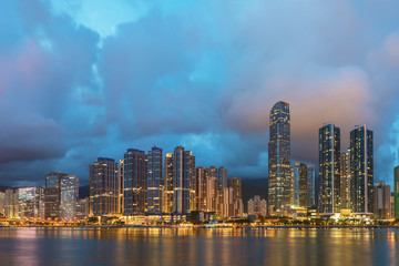 Fototapeta na wymiar Panorama of skyline and Harbor of midtown of Hong Kong city at dusk