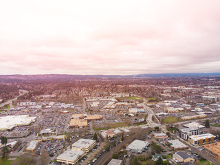 Obraz premium Suburb, city at sunset. Houses and streets from above. Background