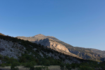 Fototapeta na wymiar Mountains against the blue sky . Mountains in Montenegro. Selective focus.