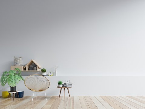 The interior has a chair on empty white wall background.