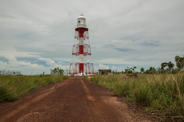 Fototapeta na wymiar Lighthouse on red cliffs, Cox Peninsula, Darwin, Northern Territory, Australia.