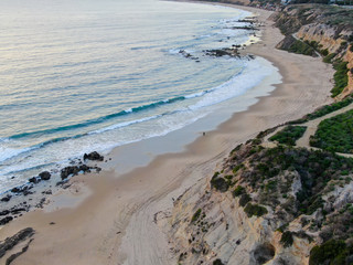 Aerial view of Newport Beach, cliff and beach during sunset twilight in southern California, USA