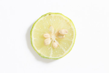 Fresh key lime on white background. Selective focus. Soft focus.