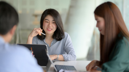 Cropped shot of professional designer team consulting on their project  in meeting room