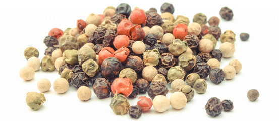 Colored pepper on white background. Cooking spice