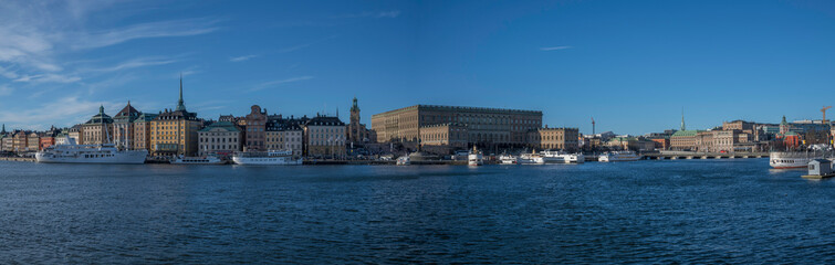 Fototapeta na wymiar Winter view over the old town of Stockholm, with churches, castle boats and ferries.