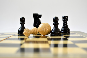 The black pawn defeated white queen on the chessboard