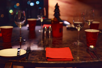 Dating at Night, Romantic Dinner Table Setting in a Restaurant decorated in Christmas Festival theme. Dating, Valentine, Festivals, Holidays, Seasons, Cuisine and Decoration concept.