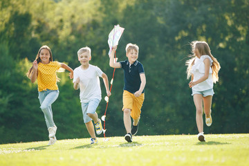 Obraz premium A group of children are playing in nature.