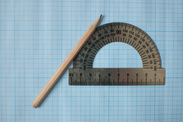 Mathematics geometry tool for student in math class with copy space for text on paper graph...