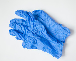 Blue gloves against white background