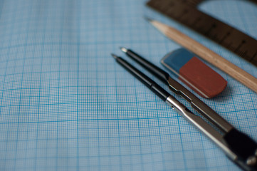 Mathematics geometry tool for student in math class with copy space for text on paper graph background