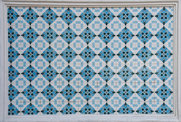 Blue and white geometric peranakan tile mosaic.