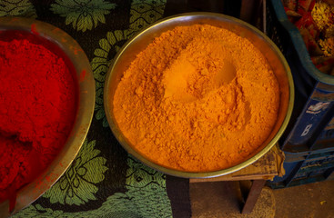Yellow color turmeric powder in a steel bowl