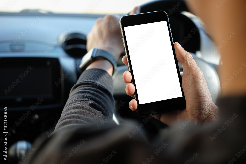Poster cropped shot view the driver uses the phone while driving. modern smart phone with round edges. isol