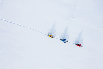 Aerial drone photo of a group of friends riding their fat bike in the snow in Ontario, Canada