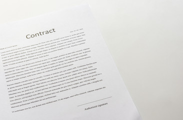 White table with paper contract detail and empty space to sign authorized signature