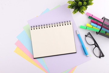 Top view blank notebook with pen on white background