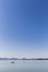 Small boat sailing on Trasimeno lake, Italy