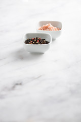Fototapeta na wymiar Salt and Pepper on a table