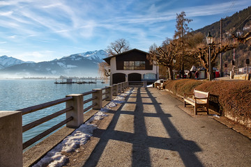 Early spring morning on the shore of alpine lake