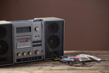 old tape recorder and cassette on  wooden table