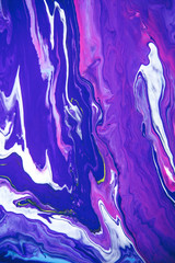 Acrylic paint liquid in trend purple and blue color mix background.