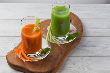 Homemade vegan green juice with vegetables, carrots, celery and herbs. Antioxidant drink