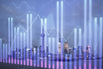 Forex chart on cityscape with tall buildings background multi exposure. Financial research concept.