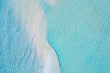 Beautiful aerial photo of exotic sandbank, idyllic tropical beach landscape, blue sea ripples and white sand. Romantic and relaxing summer mood background or wallpaper 