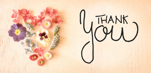 Notalgic Wooden Background With English Calligraphy Thank You. Colorful Spring Flower Blossoms Heart