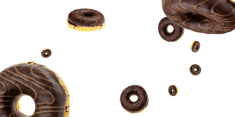 Glazed sprinkles. Chocolate sweet fresh donuts in motion flying on white background.