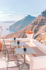 Beautiful panoramic view on the mediterranean sea, caldera and volcano. Traditional white architecture of Santorini island, Thira, Greece. Cruise ship in blue sea.