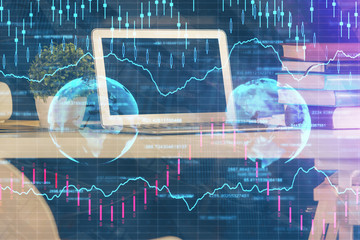 Financial graph colorful drawing and table with computer on background. Double exposure. Concept of...
