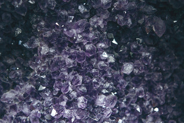 Close-up or macro of a lilac or violet mineral of amethyst druse