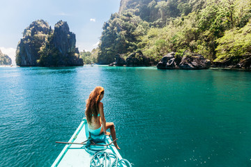 Girl travelling on the boat in Asia