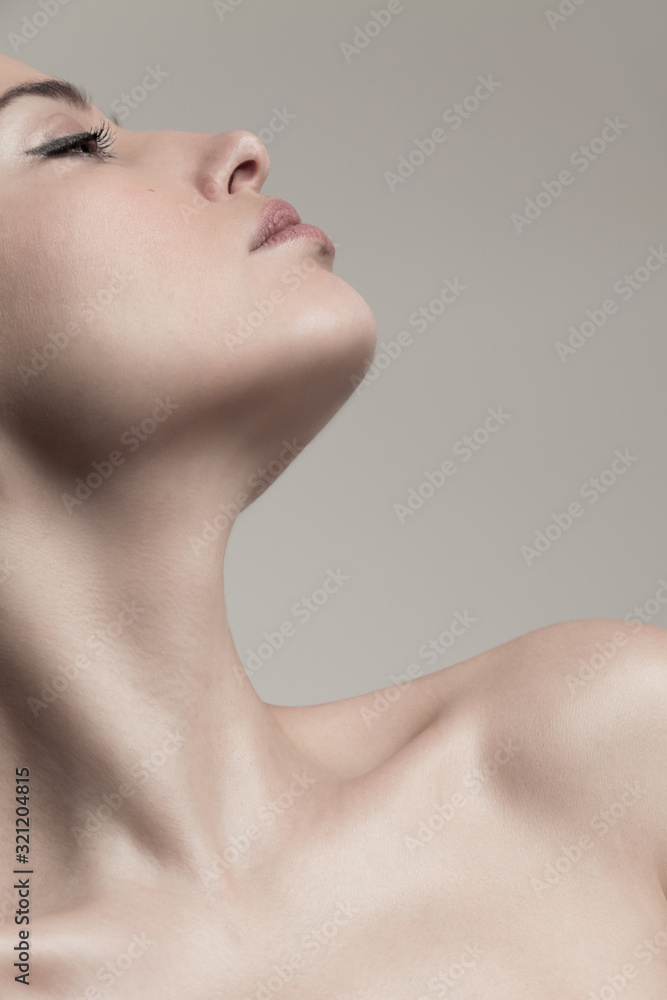 Wall mural natural beauty concept young woman  profile  face and neck studio shot