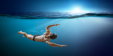 Obraz na płótnie Canvas Swimmer at competition. Mixed media