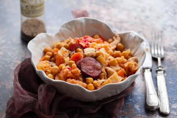 chick pea with cabbage, carrot and smoked sausages in beautiful bowl