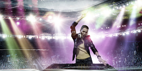 Female dj in nightclub. Mixed media