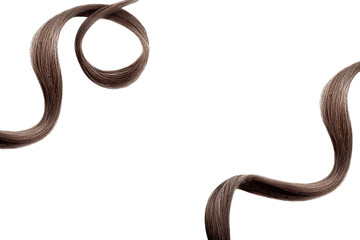 Brown hair on white, isolated. Thin curly threads as background