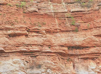 Multi-layered lime and feric lines in wall surface of mine