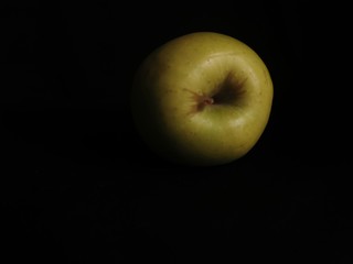 green apple on black background