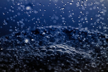 Fototapeta na wymiar Falling water drops in frozen motion.